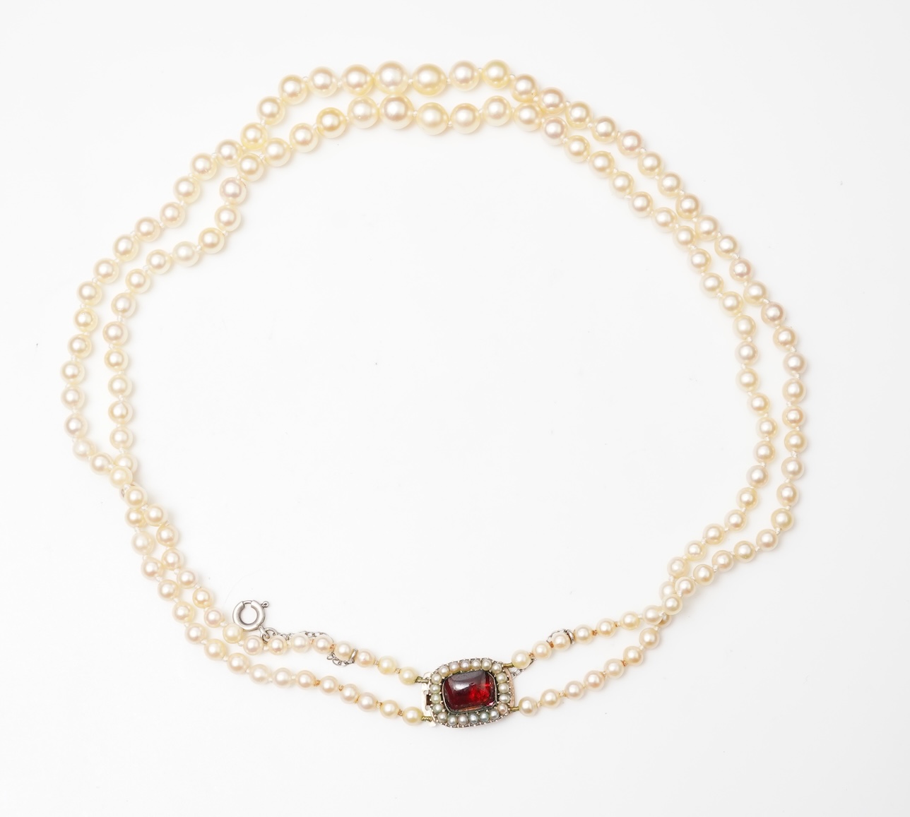 A cultured pearl and garnet necklace, 19th century and later